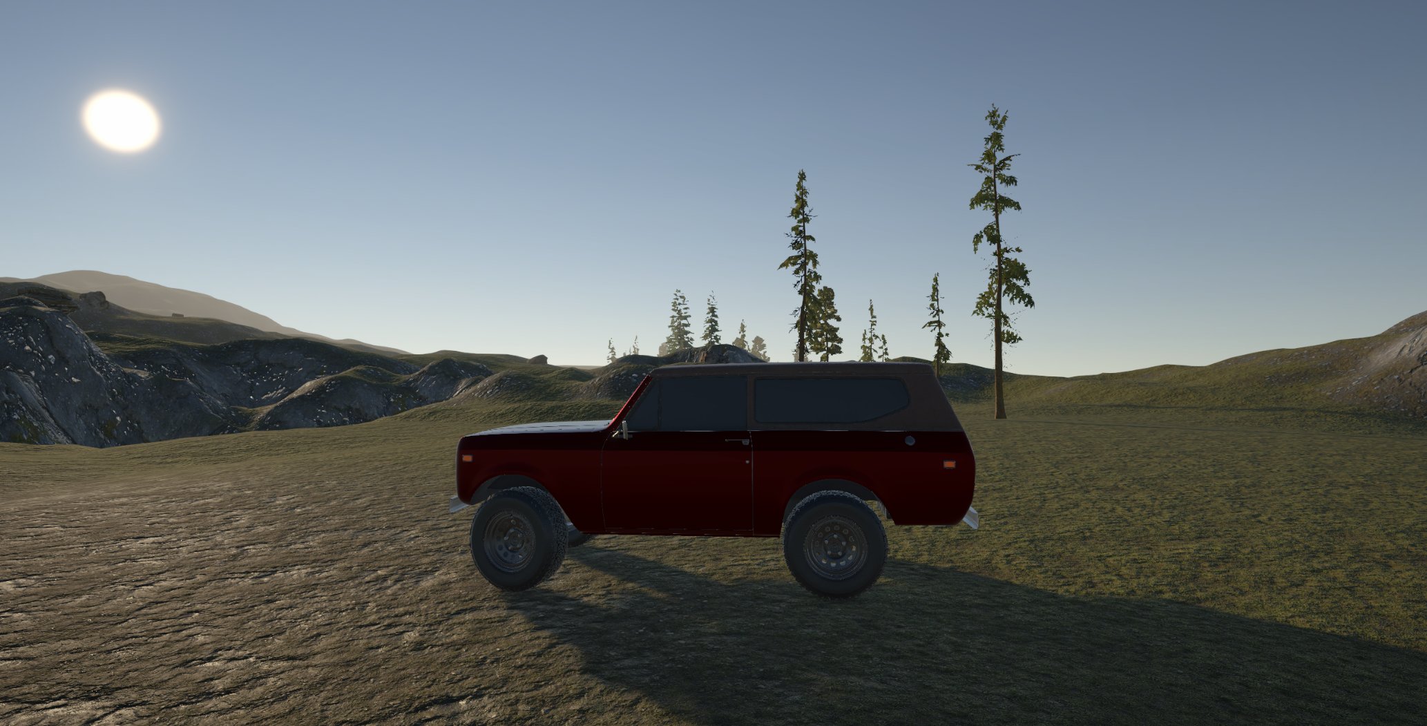Side profile of the Scout in an open golden-hour meadow in Granite Country